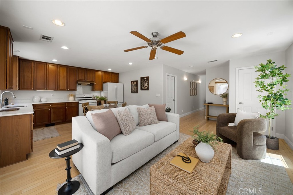 1012 La Costa Court Atascadero, CA 93422 - Photo 2 of 21 a living room with furniture kitchen view and a chandelier
