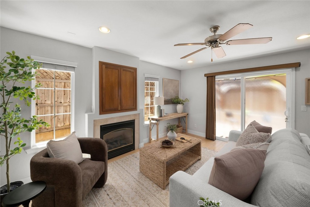 1012 La Costa Court Atascadero, CA 93422 - Photo 7 of 21 a living room with furniture a fireplace and a flat screen tv