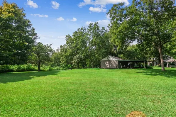 a backyard of a house with lots of green space