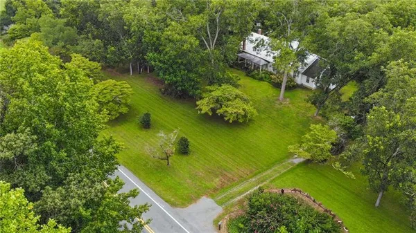 a view of a lake with a yard