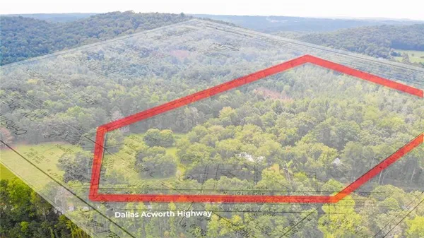 a white and red umbrella sitting in a yard