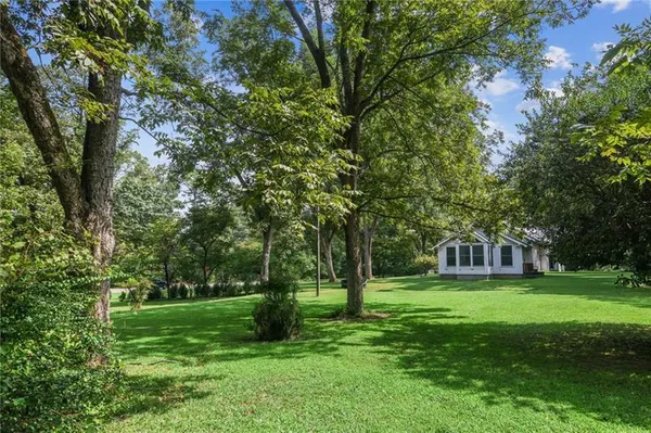 a view of a house with a big yard