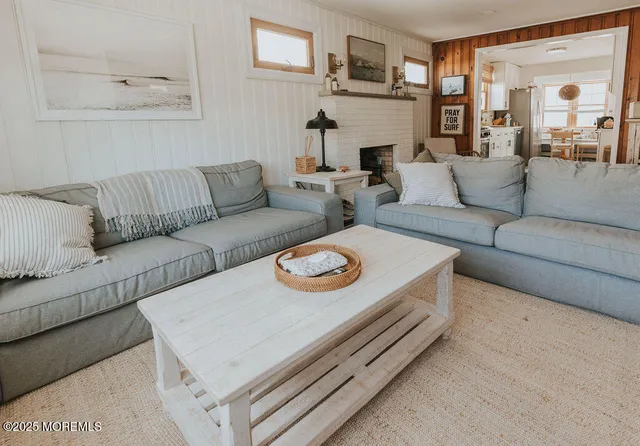 a bedroom with two beds and a table