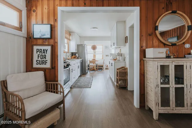 a view of a hallway to rooms and fire place