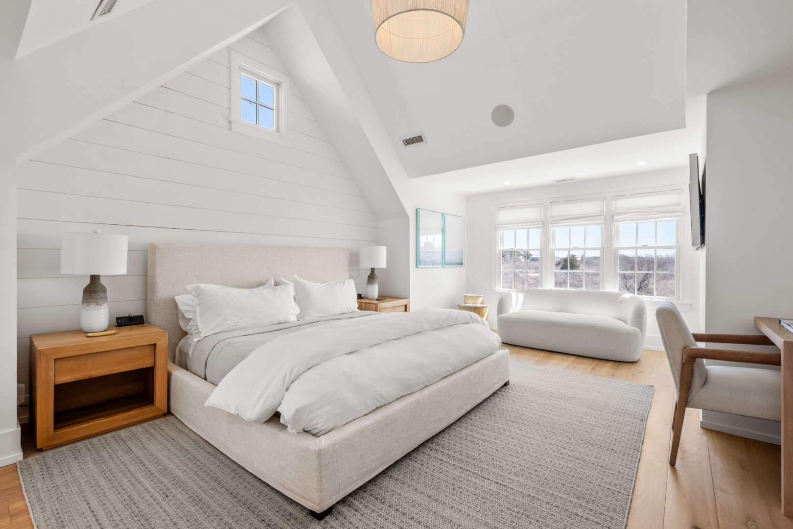 174 Cliff Road Nantucket, MA 02554 - Photo 25 of 49 a bedroom with a bed and wooden floor
