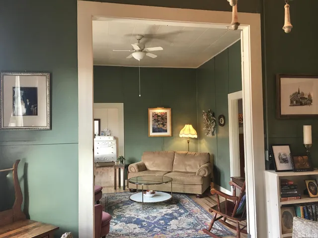 a living room with furniture and a fireplace