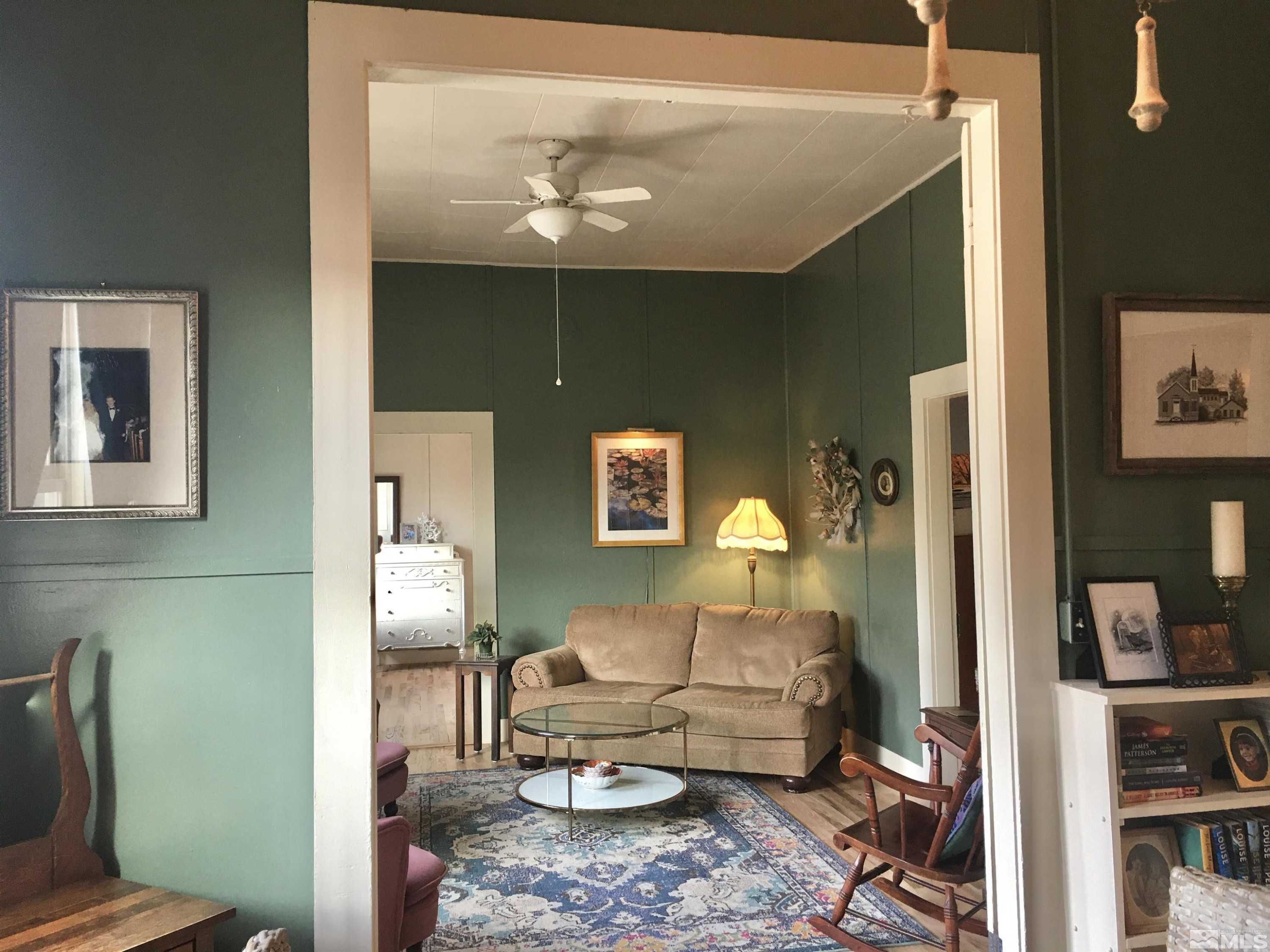 140 Water Street Austin, NV 89310 - Photo 24 of 43 a living room with furniture and a chandelier