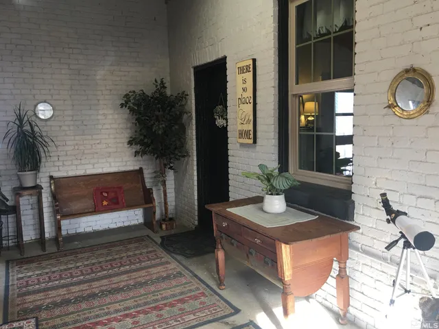 a view of a door and chair and door in the house