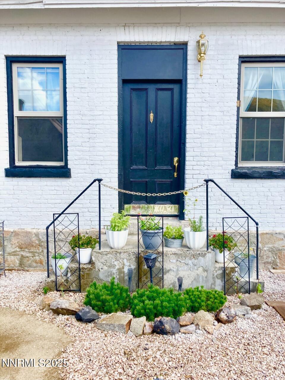 140 Water Street Austin, NV 89310 - Photo 34 of 43 a view of a house with a small yard and potted plants