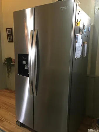 a stove top oven sitting inside of a kitchen