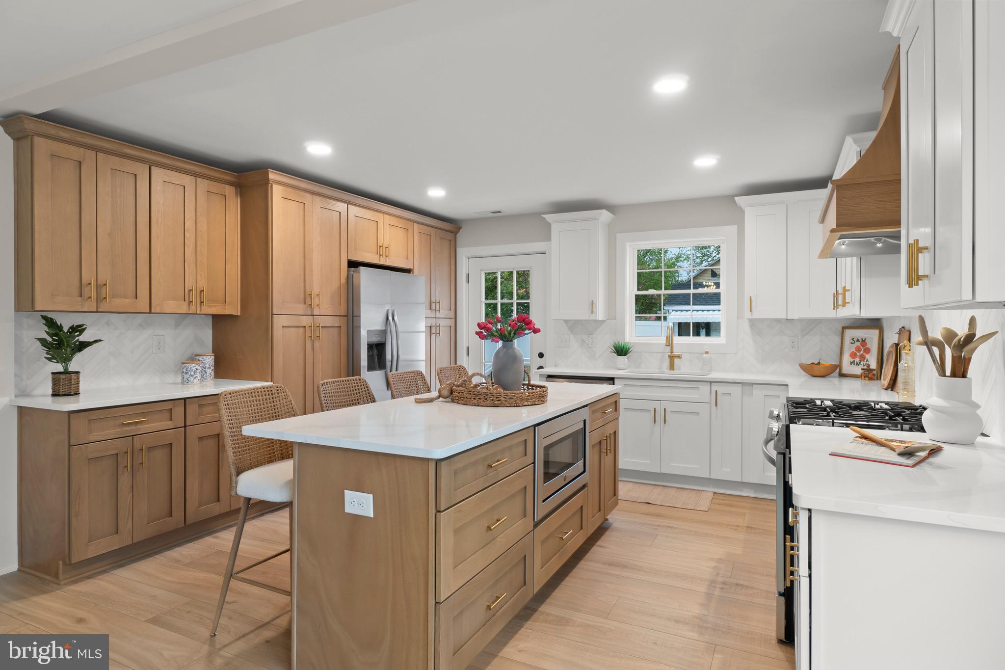 1505 Chestnut Avenue Haddon Heights, NJ 08035 - Photo 14 of 38 a kitchen that has a lot of white cabinets and stainless steel appliances