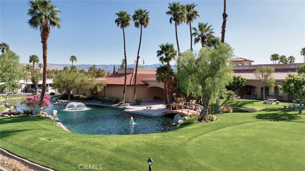 69801 Ramon Road, Unit 38 Cathedral City, CA 92234 - Photo 32 of 47 a view of a swimming pool and lounge chairs