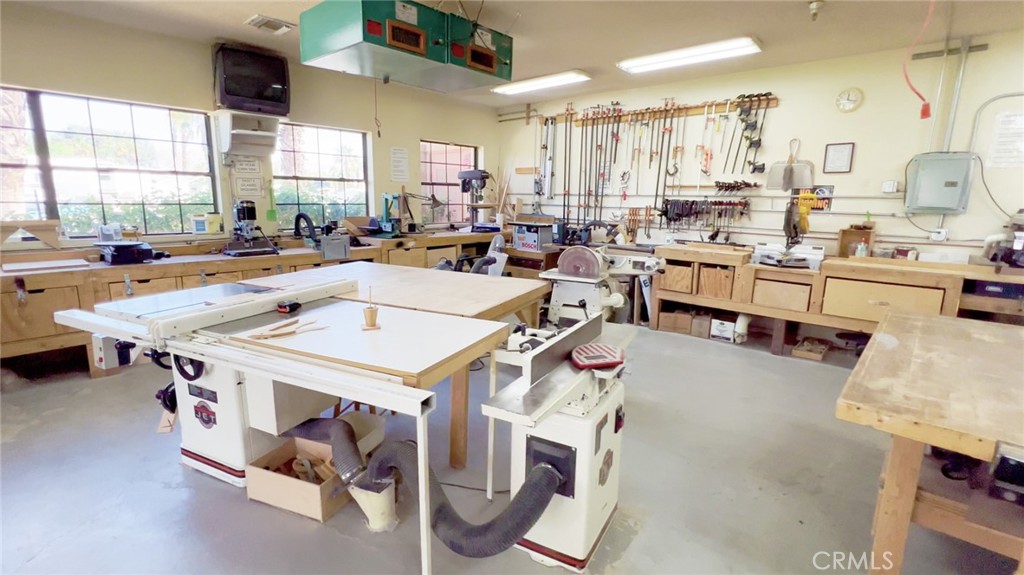 69801 Ramon Road, Unit 38 Cathedral City, CA 92234 - Photo 38 of 47 a room with stainless steel appliances lots of white furniture a window a sink and a refrigerator