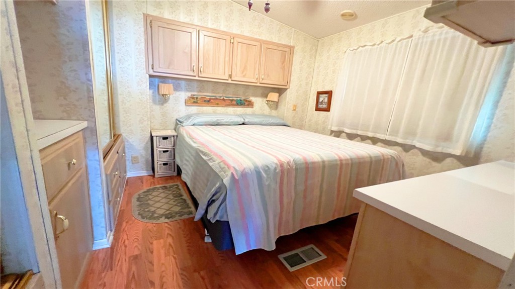 69801 Ramon Road, Unit 38 Cathedral City, CA 92234 - Photo 4 of 47 a bedroom with a bed and a window