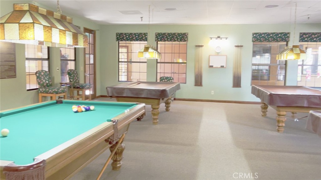 69801 Ramon Road, Unit 38 Cathedral City, CA 92234 - Photo 47 of 47 a room with pool table and windows