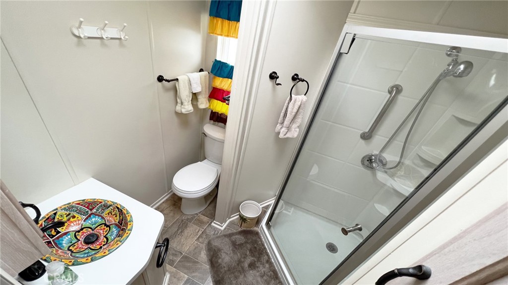 69801 Ramon Road, Unit 38 Cathedral City, CA 92234 - Photo 5 of 47 a bathroom with a toilet and a sink