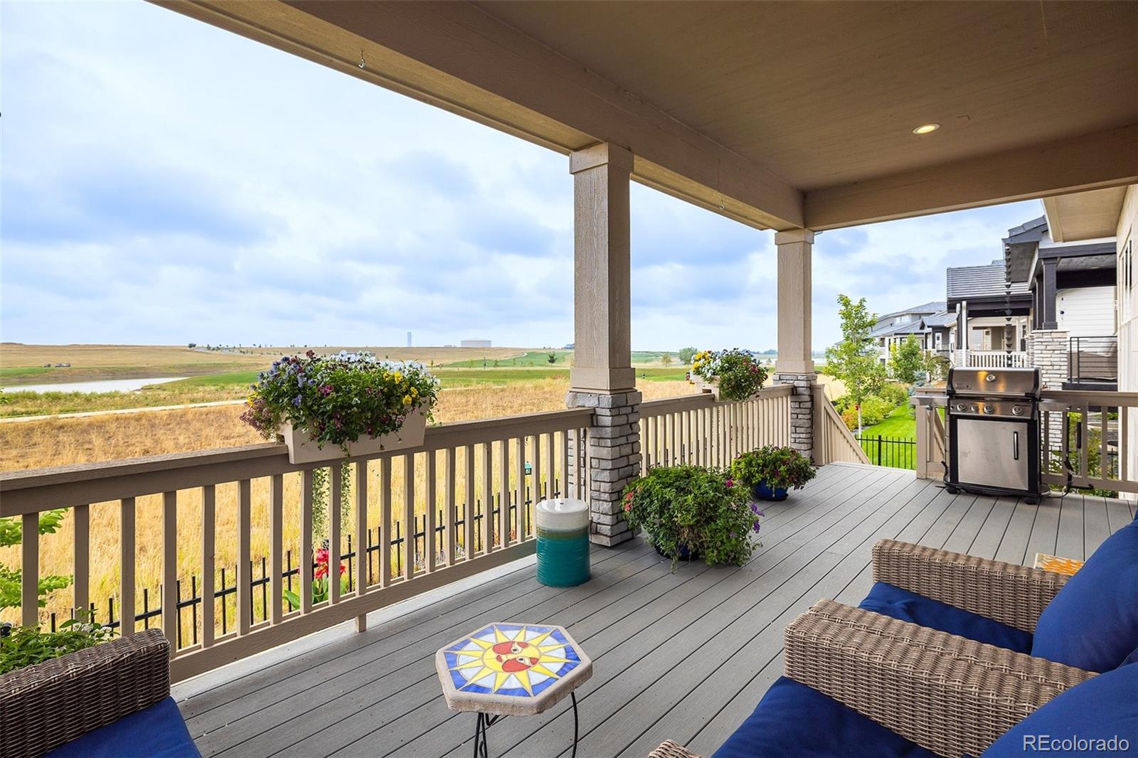 2940 Newfound Lk Road Berthoud, CO 80513 - Photo 12 of 42 a view of a balcony with couches and wooden floor