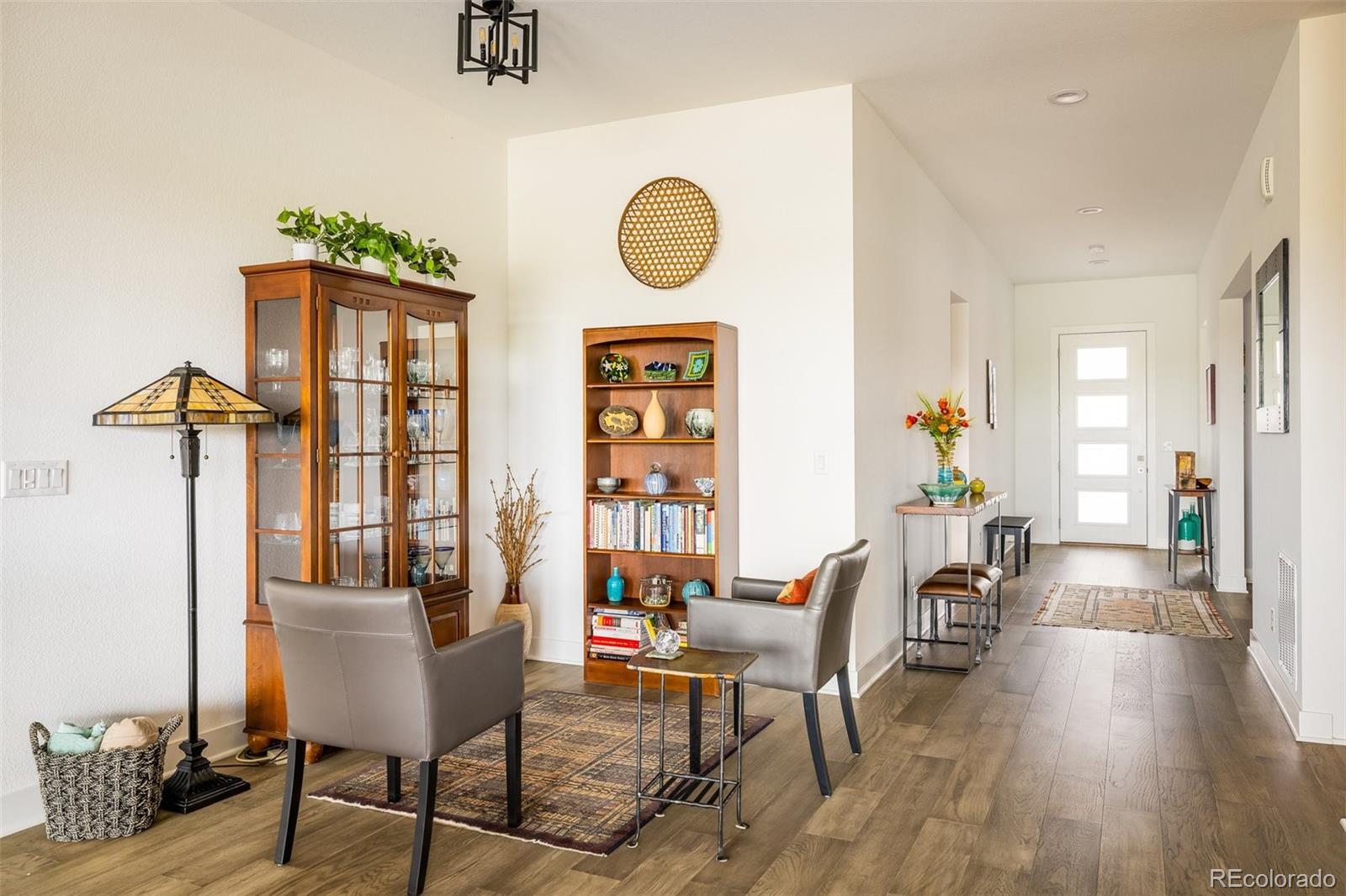 2940 Newfound Lk Road Berthoud, CO 80513 - Photo 13 of 42 a view of a dining room with furniture and wooden floor