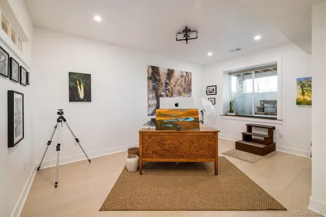 a living room with furniture and a rug