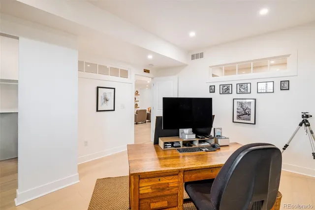 a workspace with furniture and window