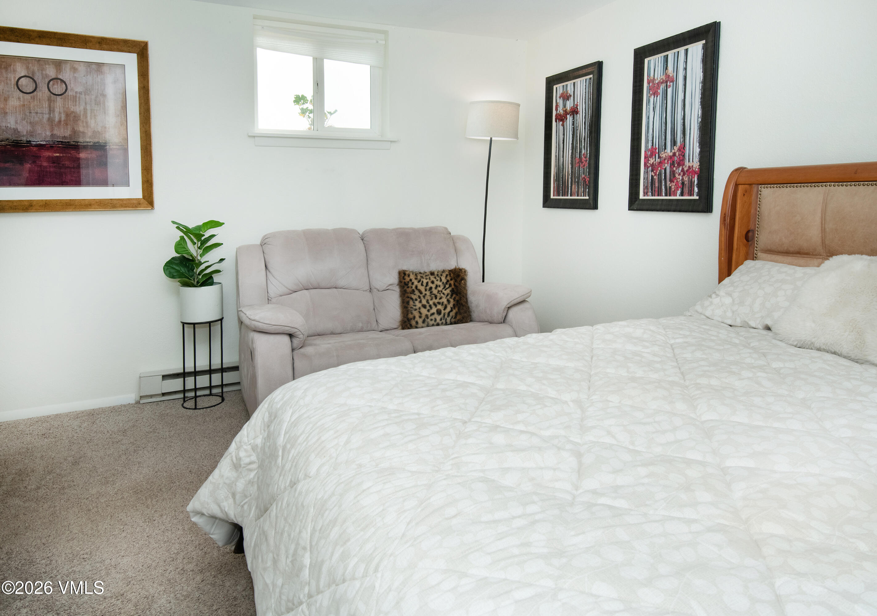 85 Chambers Avenue, Unit 10 Eagle, CO 81631 - Photo 22 of 41 a bedroom with a large bed and a couch