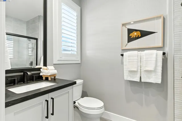 a bathroom with a shower and a sink