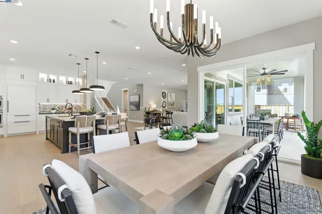 a kitchen with stainless steel appliances a stove and a refrigerator