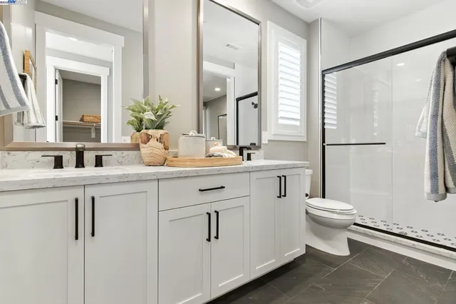 a bedroom with a bed chair and a window