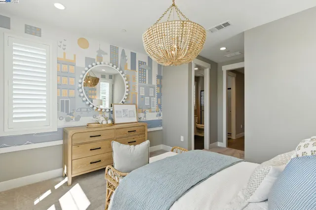 a bathroom with a granite countertop sink mirror and bathtub