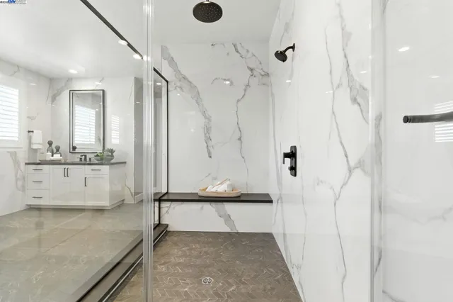 a bedroom with a bed couch and window