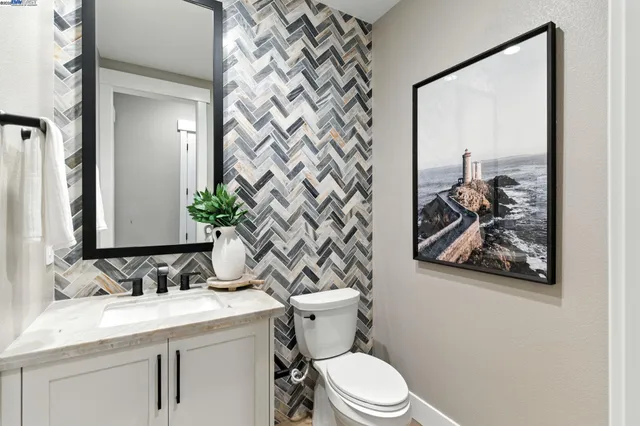 a bedroom with a bed and a stove top oven