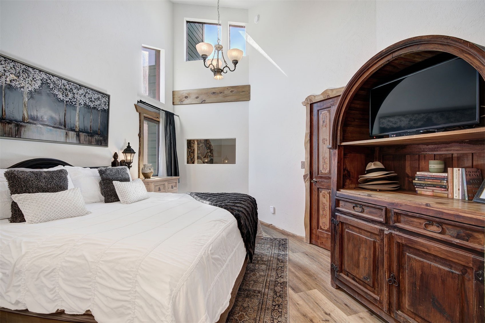 9460 Ryan Gulch Road, Unit 9460 Silverthorne, CO 80498 - Photo 13 of 39 a bedroom with bed and cabinets