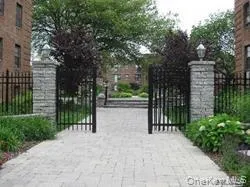 a view of street along with wooden fence