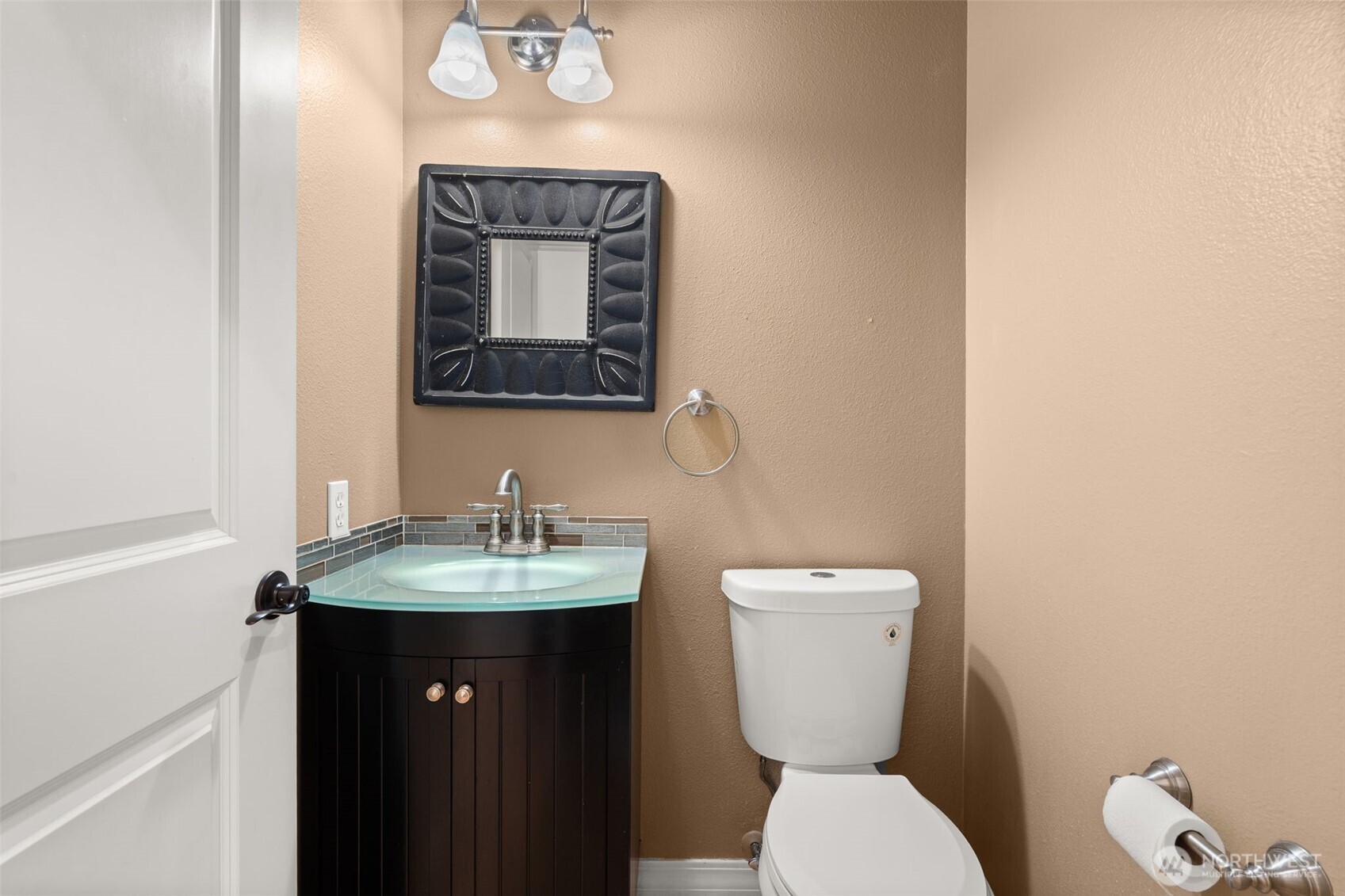9609 346th Street South Roy, WA 98580 - Photo 23 of 37 a bathroom with a toilet a sink and mirror