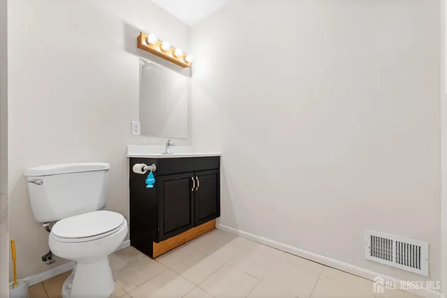 a bathroom with a toilet and a sink