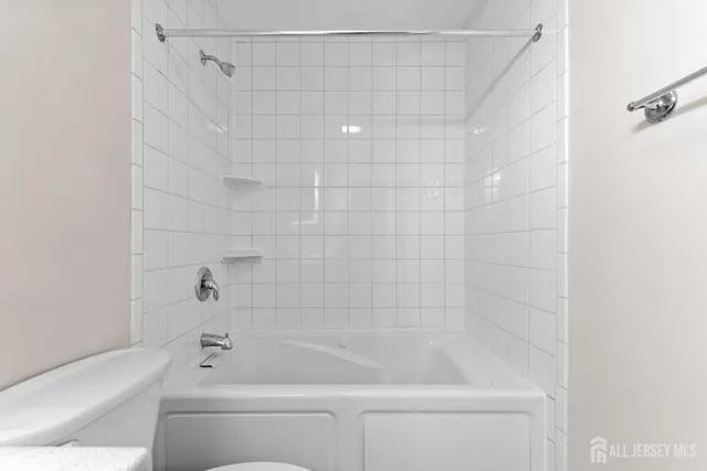 a bathroom with a shower and a bathtub