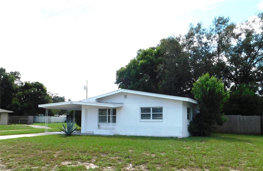 5904 Elm Street New Port Richey, FL 34652 - Photo 1 of 1 a front view of house with yard and green space