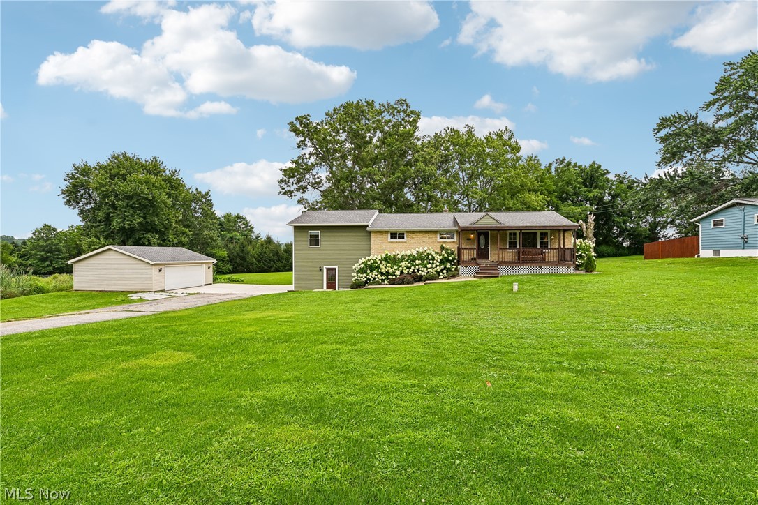 15111 Mt Eaton Road North Rittman, OH 44270 - Photo 2 of 50 Front of property with a front porch, spacious front yard and 2 car detached garage