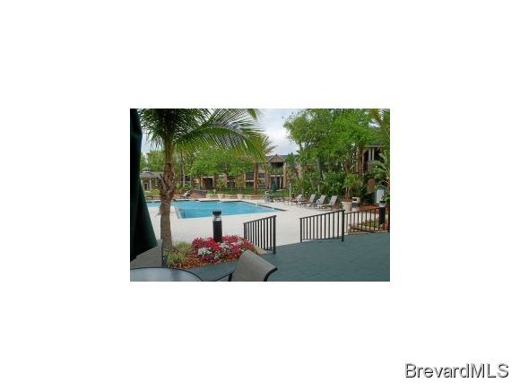 7667 North Wickham Road, Unit 712 712 Melbourne, FL 32940 - Photo 2 of 8 a picture of a bench in a backyard