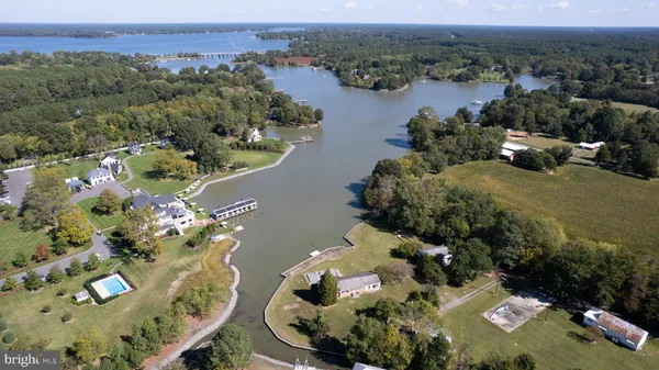 an aerial view of a house with a yard lake view