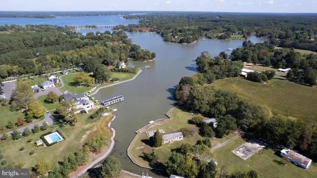 an aerial view of a house with a yard lake view