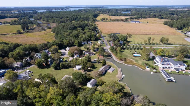 an aerial view of a house with a lake view