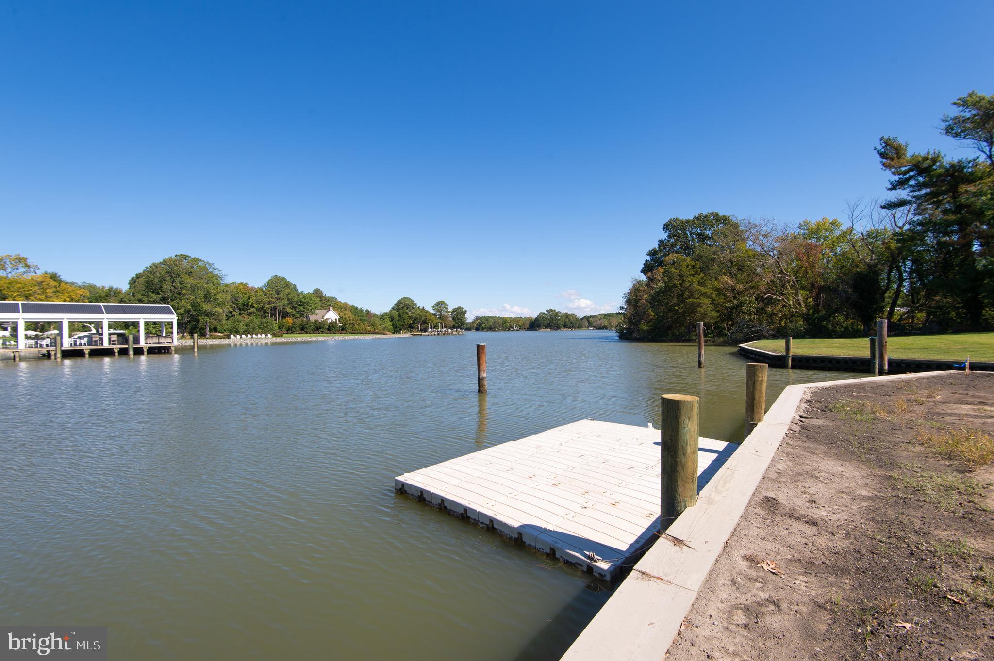 7049 Acorn Alley Newcomb, MD 21653 - Photo 20 of 40 a view of a lake with houses