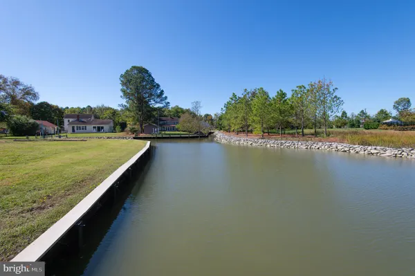 a view of a lake with a big yard
