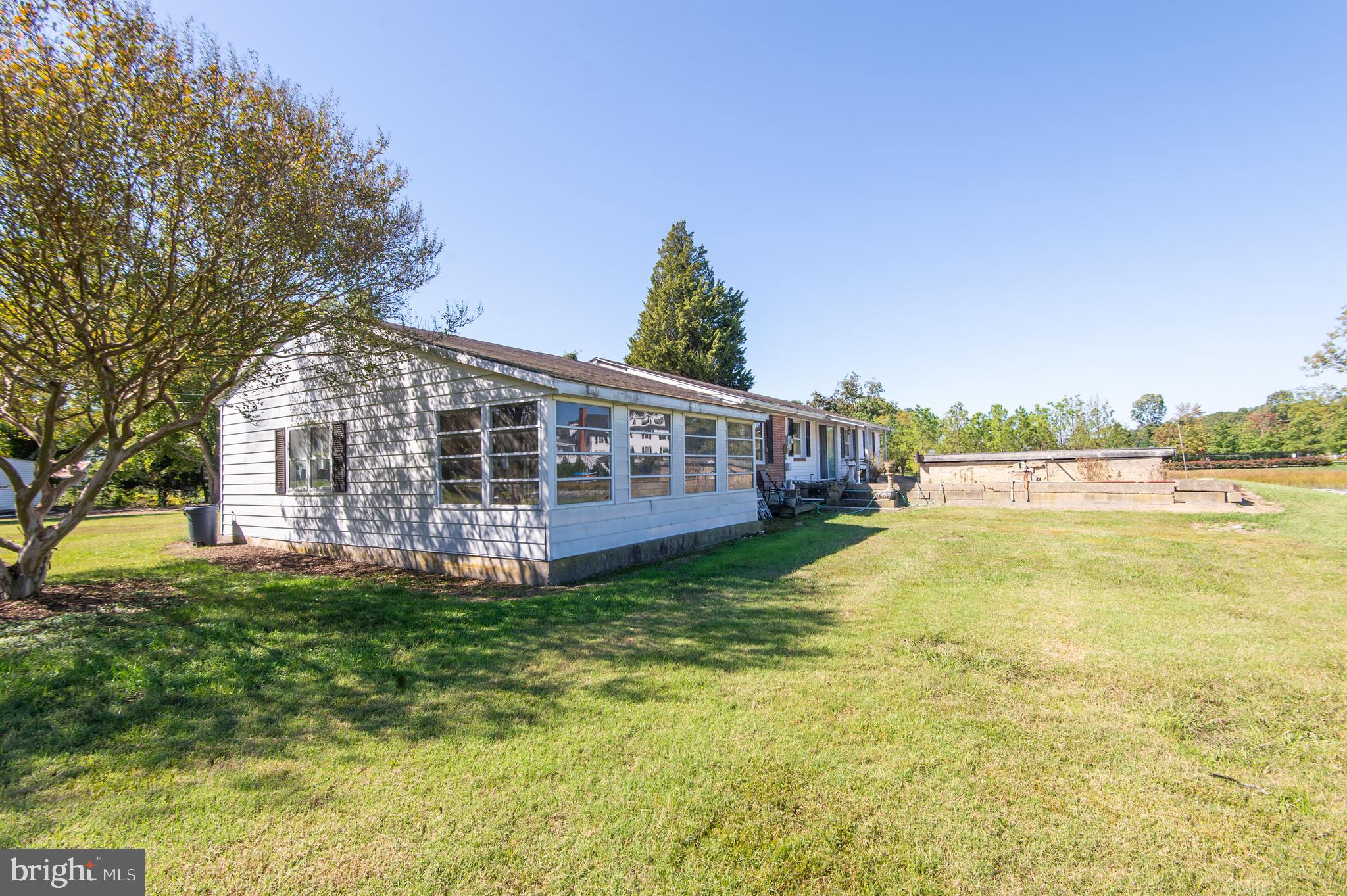 7049 Acorn Alley Newcomb, MD 21653 - Photo 23 of 40 a view of a house with swimming pool and a yard