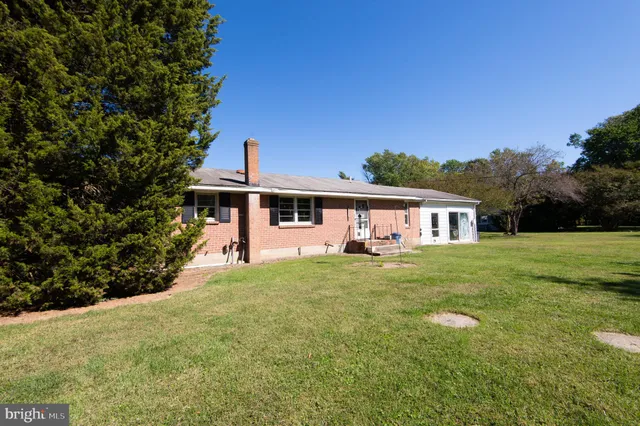 a front view of a house with yard