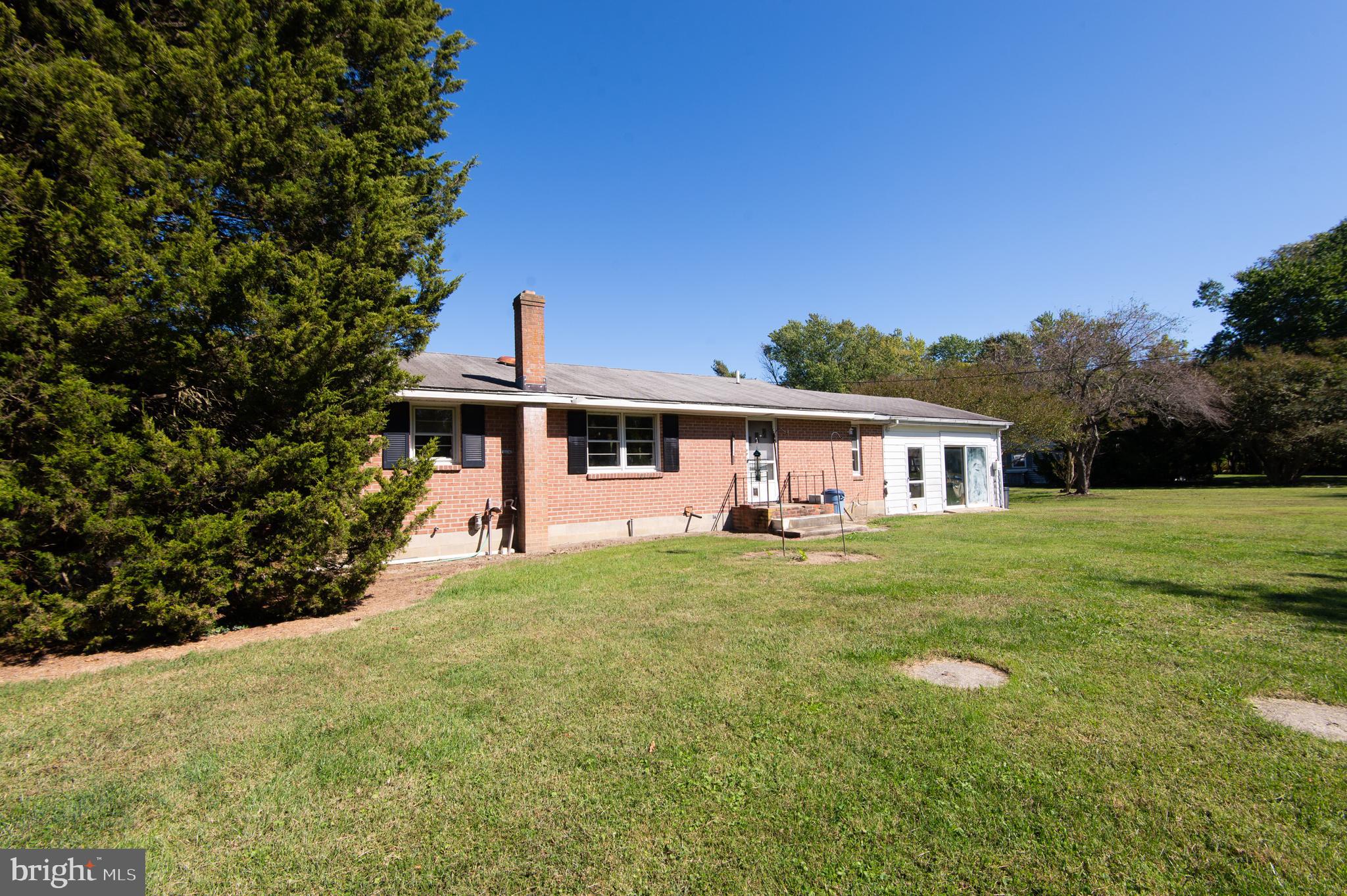 7049 Acorn Alley Newcomb, MD 21653 - Photo 27 of 40 a front view of a house with yard