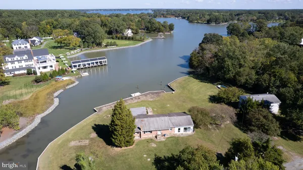 an aerial view of a house with a lake view