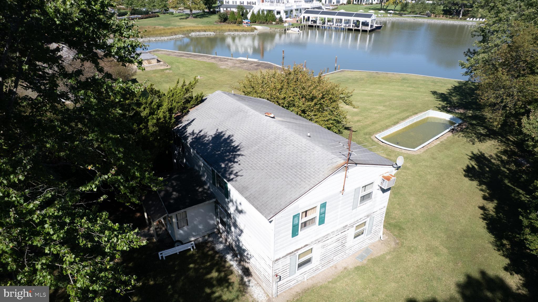 7049 Acorn Alley Newcomb, MD 21653 - Photo 40 of 40 an aerial view of a house with a lake view