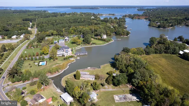 an aerial view of a house with yard